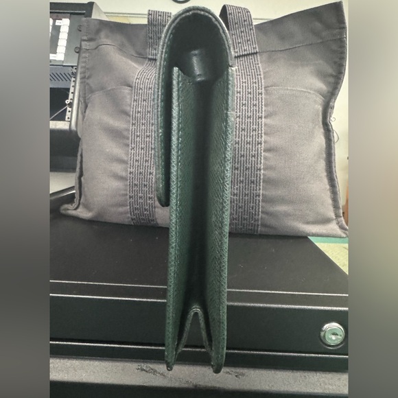 Louis Vuitton Tiaga Leather Clutch - Picture 3 of 12